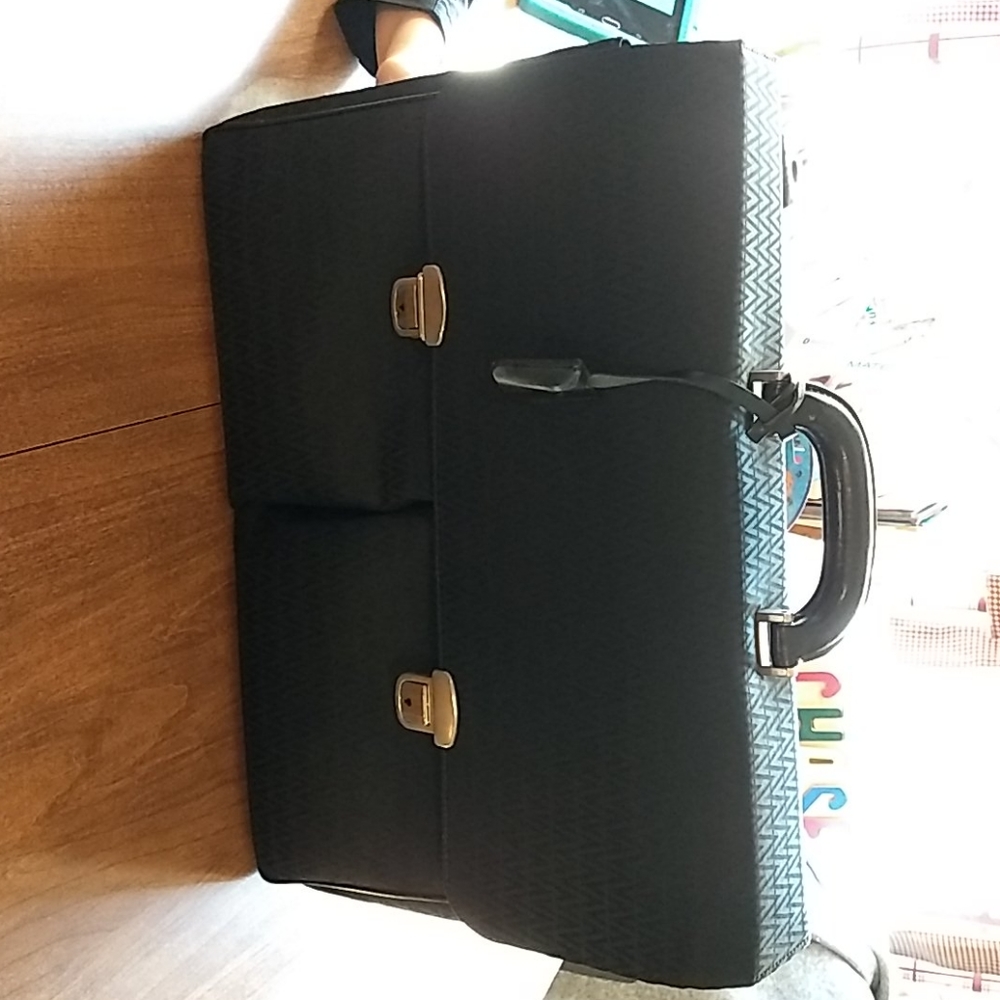 Vintage briefcase black three pockets.
